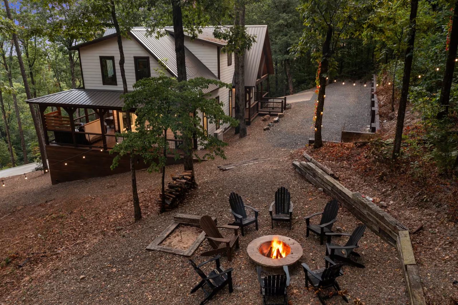 Fire pit from above, with the cabin at dusk.